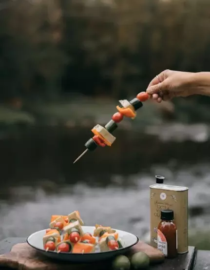 Caprese Skewers  Thread cherry tomatoes, fresh mozzarella balls (bocconcini), and basil leaves onto skewers. Drizzle with balsamic glaze and sprinkle with sea salt and freshly ground black pepper. These skewers are a delightful twist on the classic Caprese salad, perfect for picnics.Source: Pexels