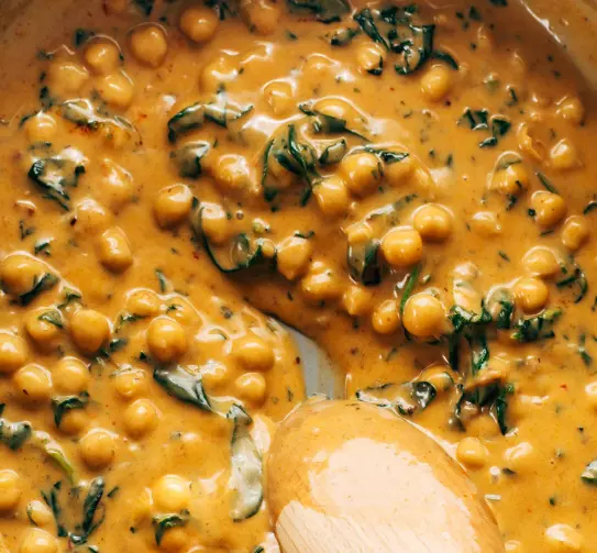 Chickpea and Spinach Curry Saute onion, garlic, and ginger in olive oil until softened. Add curry powder and cook until fragrant. Stir in diced tomatoes and coconut milk, then add chickpeas. Simmer until heated through, then add fresh spinach and cook until wilted. Season with salt and pepper and serve hot.