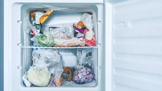 Declutter and empty your freezer before reorganizing it.