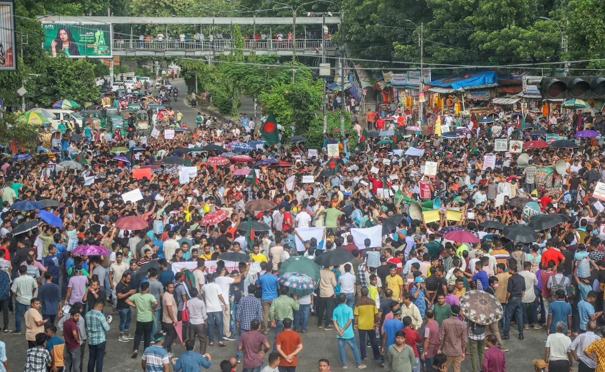 Bangladesh Hindu community members participate in a protest and block the Shahbagh intersection in Dhaka