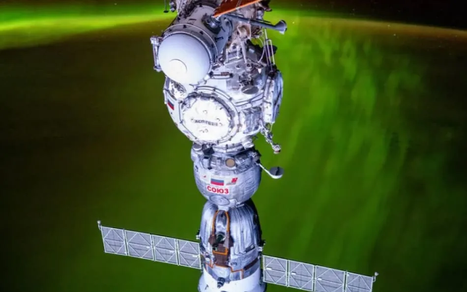 NASA Astronaut Captures Stunning Green Aurora Behind Russian Soyuz Spacecraft Docked at ISS