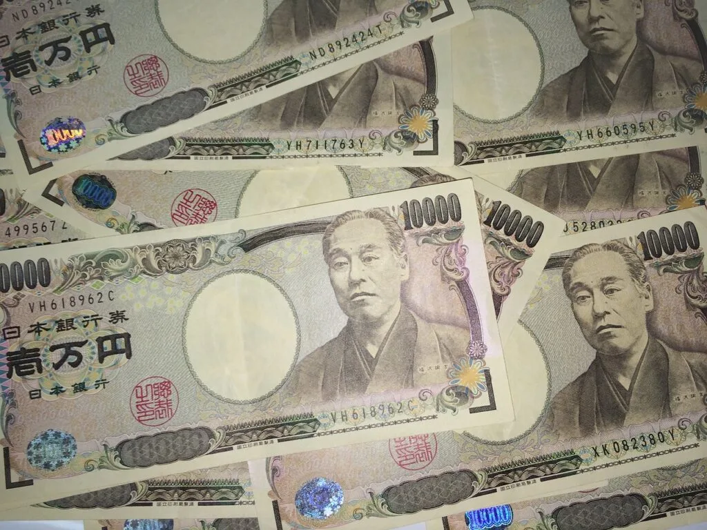 Yen jumps more than 1% against dollar on policy talk